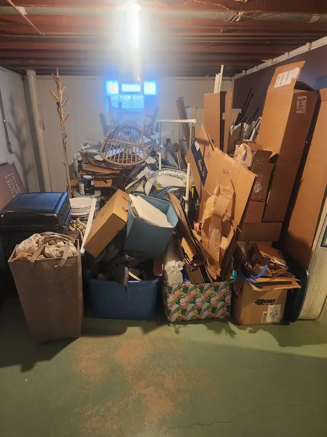 Roll-off dumpster container at job site for 4 Yard Dumpster Rental in Underhill